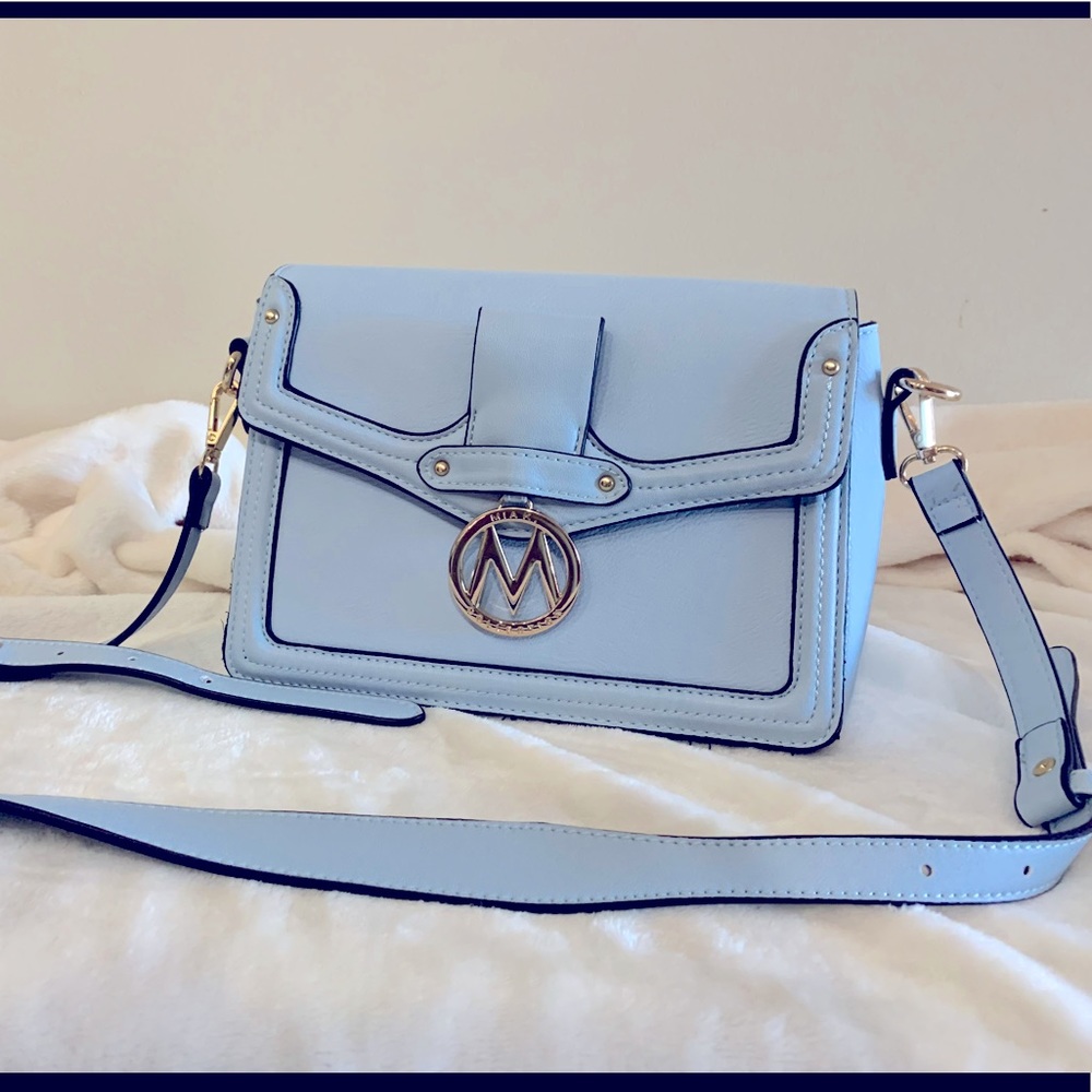 MIA K shoulder bag. Light blue 10w x 7x 4”deep leather with gold metal.